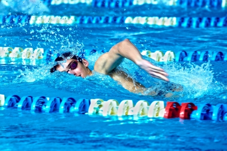 Swimmer in waterpool swim one of swimming styleの写真素材