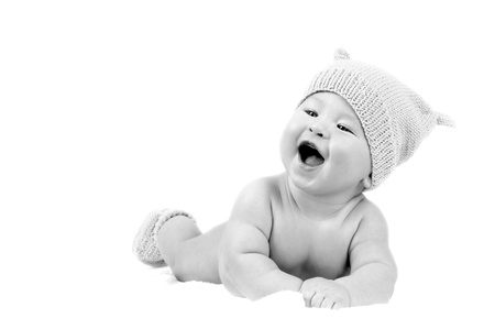 Newborn baby in the hat, isolater on the white backgroundの写真素材