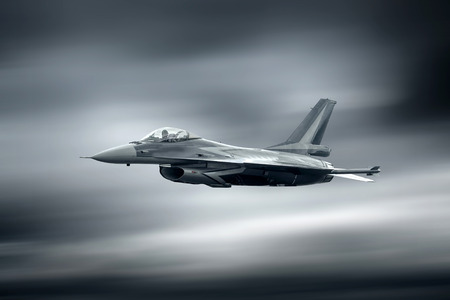 Military airplane at flying on the speedの写真素材