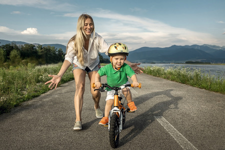Happiness Mother and son on the bicycle outdoorの写真素材