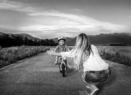Happiness Mother and son on the bicycle outdoorの写真素材