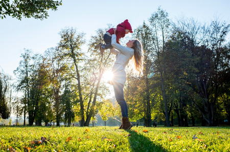 Happiness mother and son in autumnの写真素材