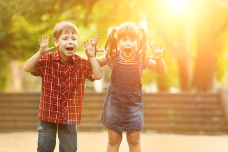 Happiness boy and girl fun outdoor under sunlightの写真素材