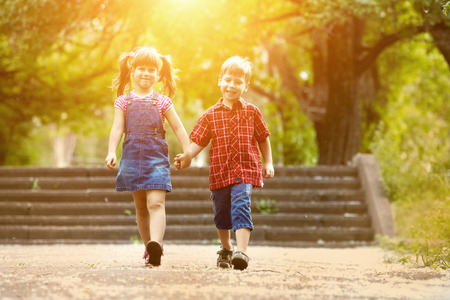 Happiness brother and sister fun outdoor under sunlightの写真素材