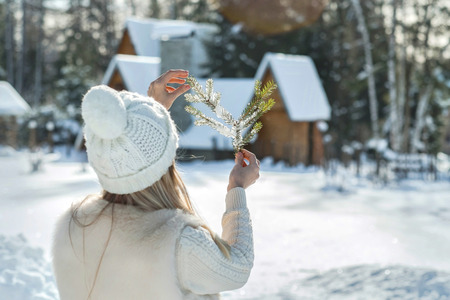 Happiness female near the winter villa in leisure timeの写真素材