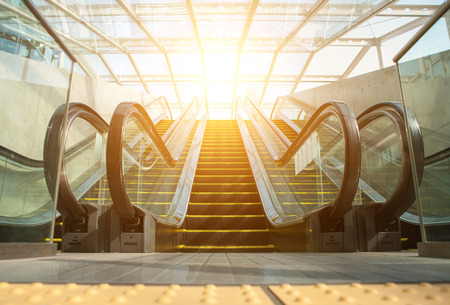 Blurry modern escalator at sunny day.の写真素材