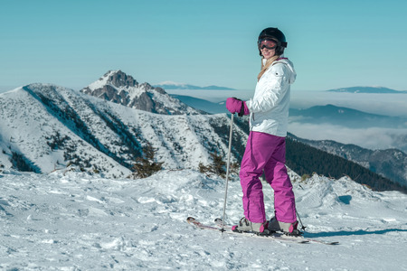 Happiness female at ski stay on the beautiful mountains viewの写真素材