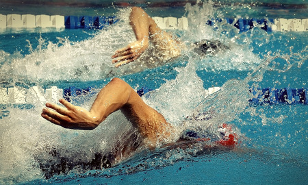 Swimming in waterpool with blue wate