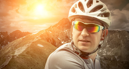 Men with bicycle aroun mountains beautiful view.の写真素材