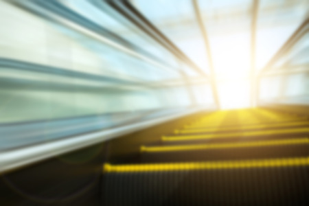 Blurry modern escalator at sunny day.の写真素材