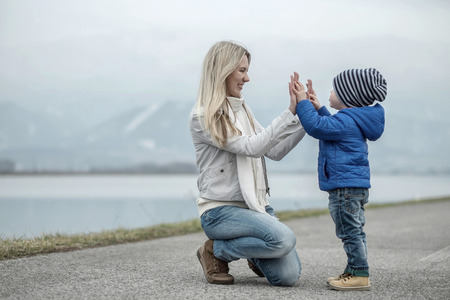 Happiness mother and son under sun lightの写真素材