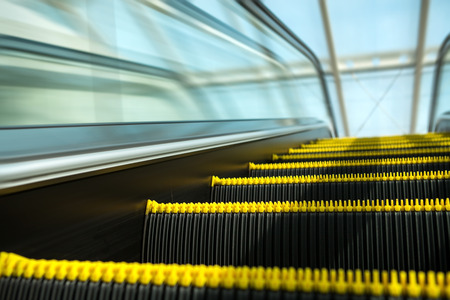 Blurry modern escalator at sunny day.