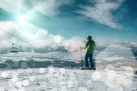 Skier stay on the peak of mountain in sunny day.の写真素材