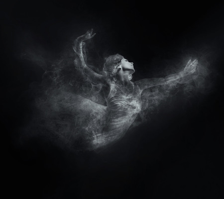 Dancer from smoke on the dark backgroundの写真素材