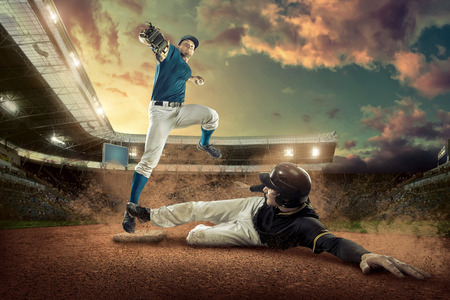 Baseball players in action on the stadium.の写真素材