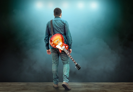 Artist Guitarist hands play on electricity guitar under light, Practicing in playing . Song entertainment and music instrument.の写真素材
