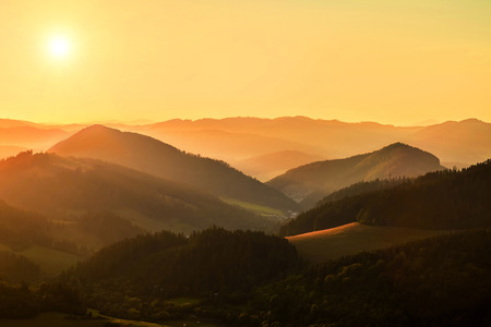 Beautfull sunset view around mountains. Sunlight on the sky with sun and cloud.