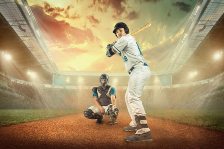 Baseball players in action on the stadium.の写真素材