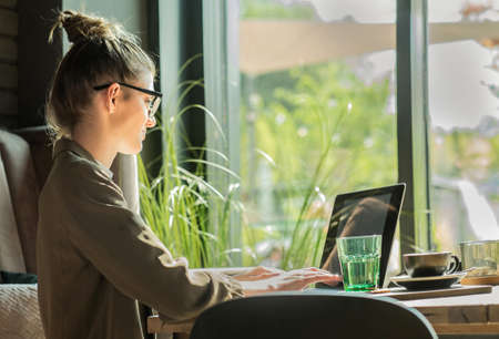 Woman working, talking on video call. Online chat with friends, long distance communication. Staying...