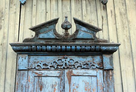 Window decoration of ancient buildings. Carved platband on an old wooden house in Krasnoyarsk.の写真素材