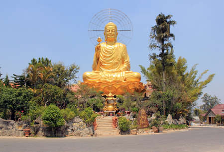 Large golden Buddha statue in the city of Dalat. Vietnam.の写真素材