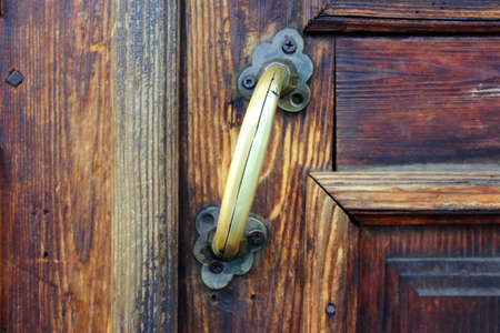 Brass door handle in an old mansion in the city of Yeniseisk. Siberiaの写真素材