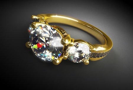 Gold ring with diamonds on a black backgroundの写真素材