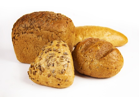 several fresh loaves of bread on a white background