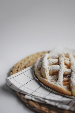Apple pie with white towel on wooden tray. Dessert. Homemade cake with apples.の写真素材
