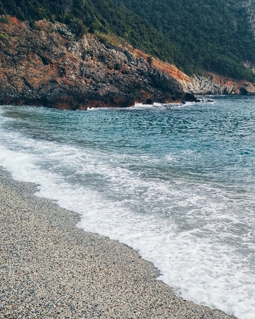 Summer beach coastline. Beautiful blue sea with rocks. Island without people. Cleopatra beach in Turkey, Alanyaの写真素材
