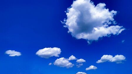 Beautiful white clouds like a wool on classic blue color of the year 2020 sky.