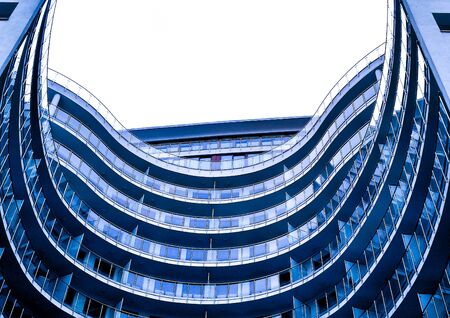 Classic blue glass office futuristic building in the city centre till the skyの写真素材