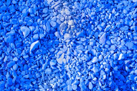 Beach peebles texture background in trendy color classic blueの写真素材