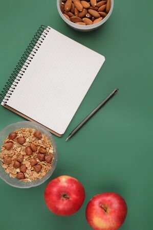 Attributes of a healthy lifestyle: food on green background. Flat view of count calories with copy space. の写真素材