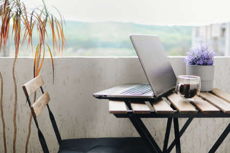 Remote working place at balcony during corona virus time on quarantineの写真素材