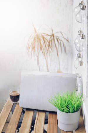 Morning routine at balcony. Remote working place at home. Work on fresh airの写真素材