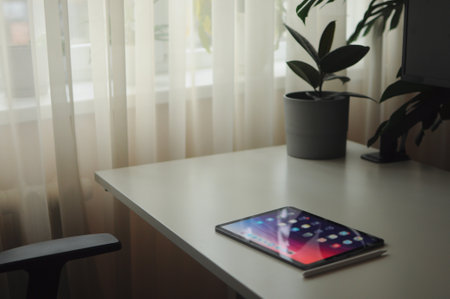 Digital sketching on touch pad tablet. Cozy atmosphere. Remote work. Home hobbyの写真素材