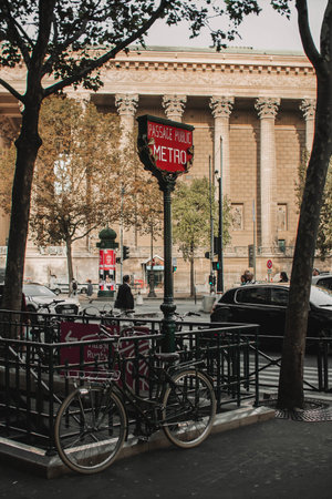A bicycle parked on the street near Passage public metro station