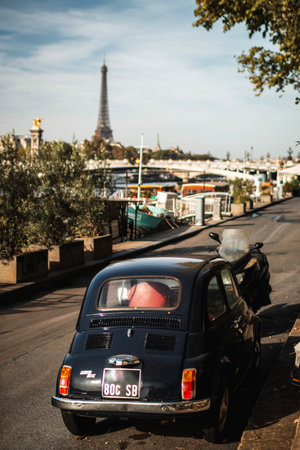 PARIS, FRANCE - OCTOBER 1, 2023: classic car on the street with an Eiffel Towerのeditorial素材