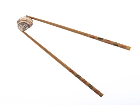 chopsticks and snail isolated on white backgroundの写真素材