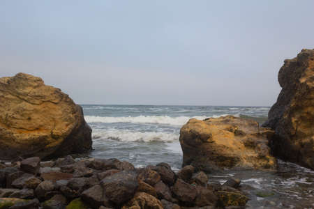 Black Sea waves washes shell rocks. Marine scene.の写真素材