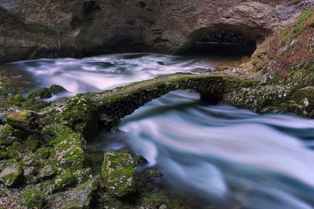 Old stone bridge over a creekの写真素材