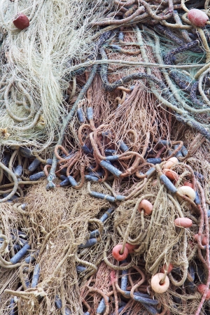 A fish net with ropes on the pierの写真素材