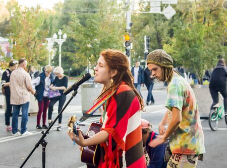 Street musicians sing the song in the middle of the street Russia,Krasnodar,october 7,2018のeditorial素材