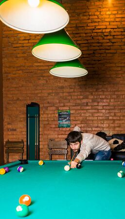 Russia,Krasnodar 19 November 2018-a man playing Billiards in the shopping centerのeditorial素材