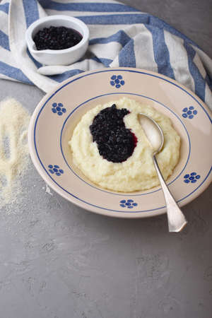 Semolina mash with elderberry compoteの写真素材