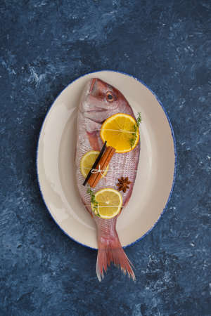 Dorada with citrus fruits and spicesの写真素材