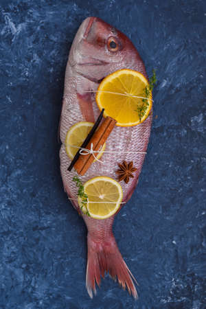 Raw fish with citrus fruits and spicesの写真素材