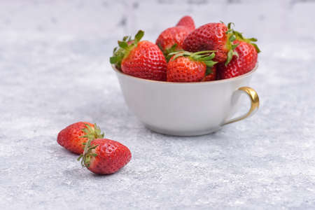 Fresh strawberries in the cup for the strawberry smoothieの写真素材