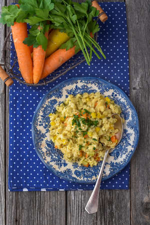 Cheese spÃ¤tzle with cheese and vegetablesの写真素材